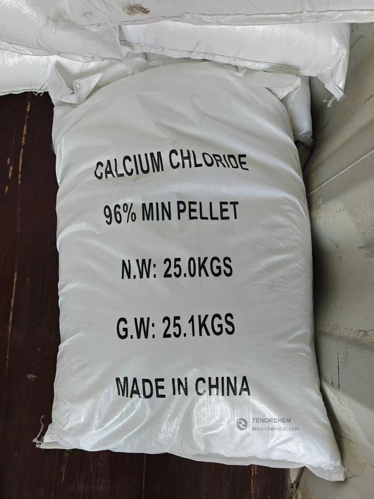 Calcium chloride pellets in a 25 kg bag labelled 96% min