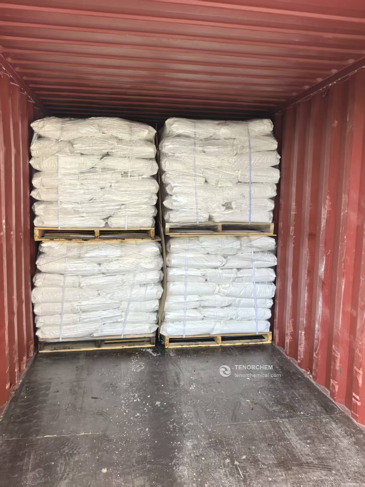 Palletized calcium chloride bags wrapped and loaded inside a shipping container