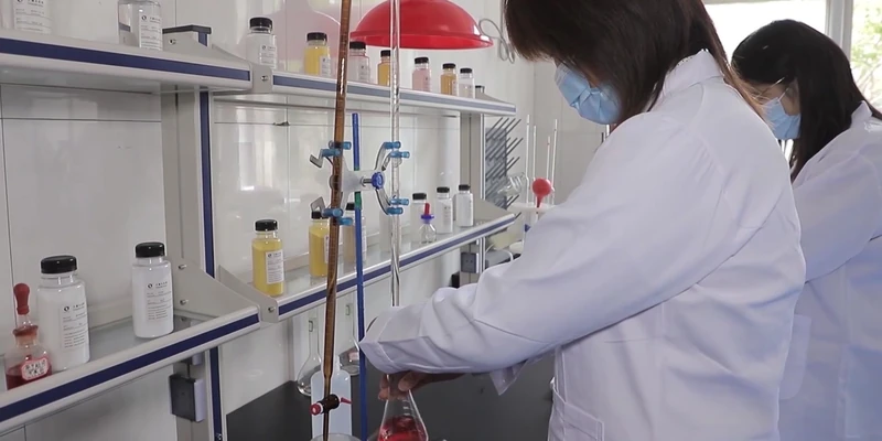TENORCHEM laboratory staff testing water samples