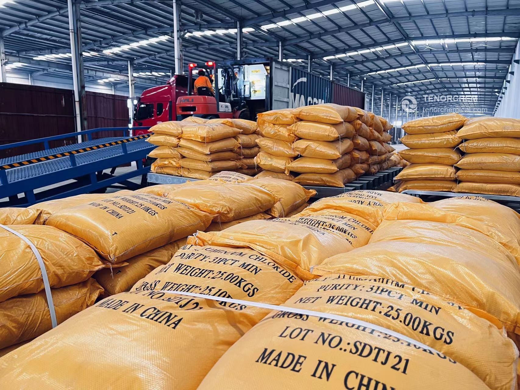 PAC 25 kg bags on pallets beside a container loading ramp