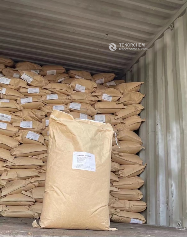 Anionic polyacrylamide kraft bags loaded in a shipping container, with a labelled bag in front