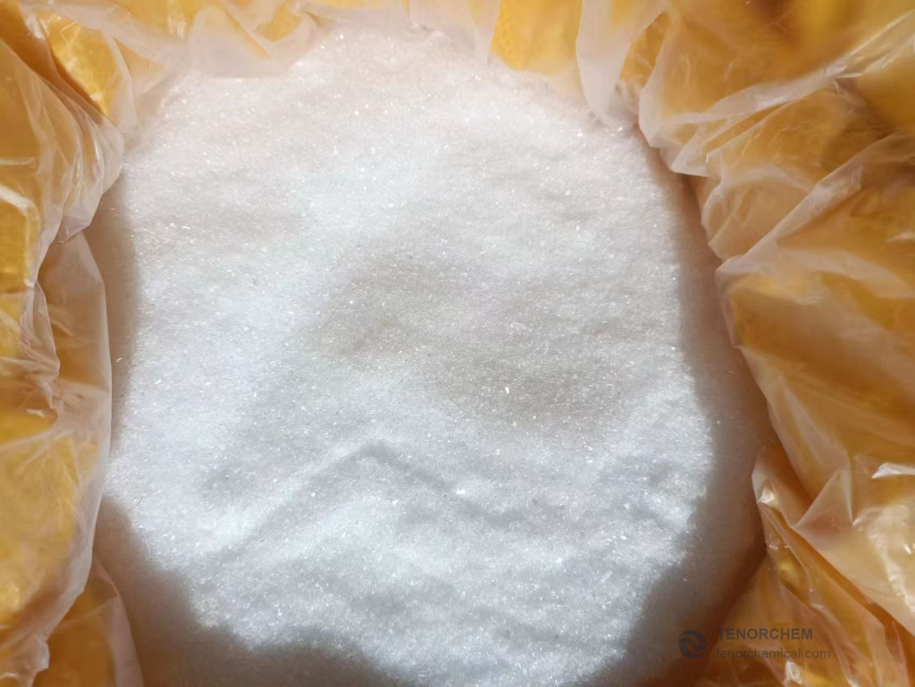 White magnesium sulfate heptahydrate crystals inside a lined yellow bag